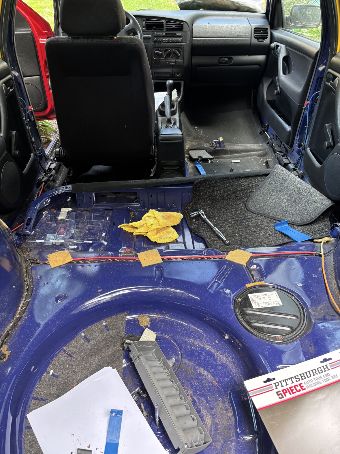Rear interior of the Harlequin stripped down to the painted floor